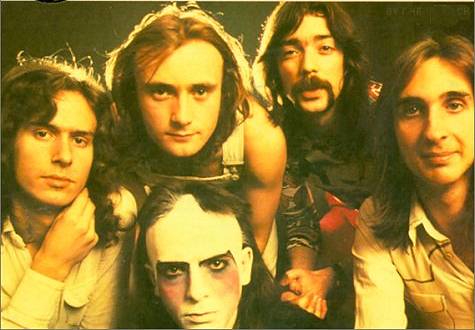 Early 70's Classic Genesis Lineup. From Left to Right: Banks, Collins (above), Gabriel (Make-up), Hackett, Rutherford